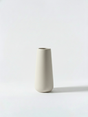 Minimalist white ceramic vase on a white background