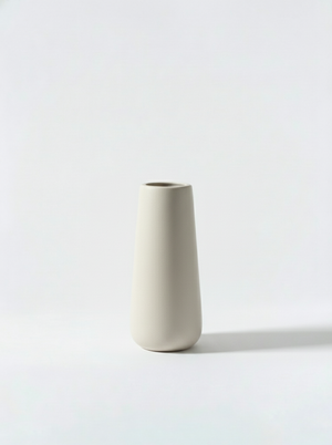 Minimalist white ceramic vase on a white background