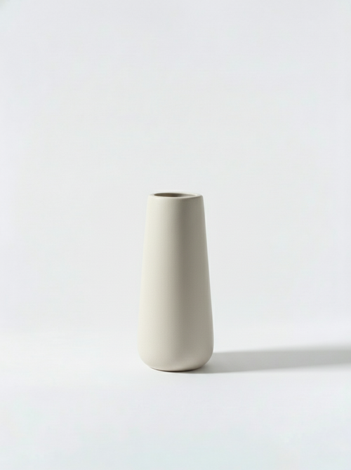 Minimalist white ceramic vase on a white background