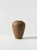 Minimalist brown ceramic vase on a white background