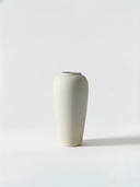 Minimalist white ceramic vase on a light grey background