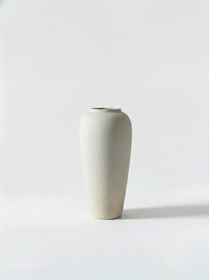 Minimalist white ceramic vase on a light grey background