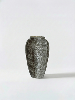 Textured ceramic vase on a white background