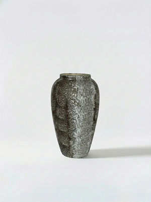 Textured ceramic vase on a white background
