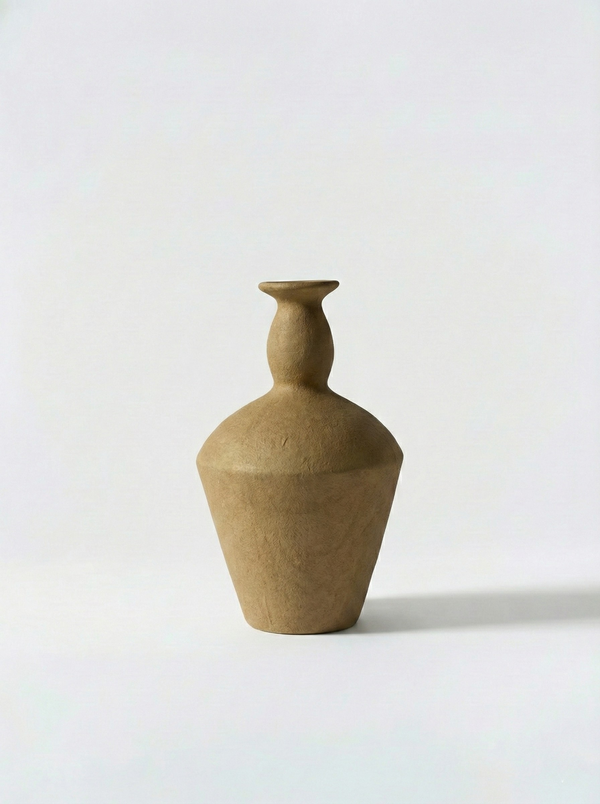 Minimalist brown ceramic vase on a white background