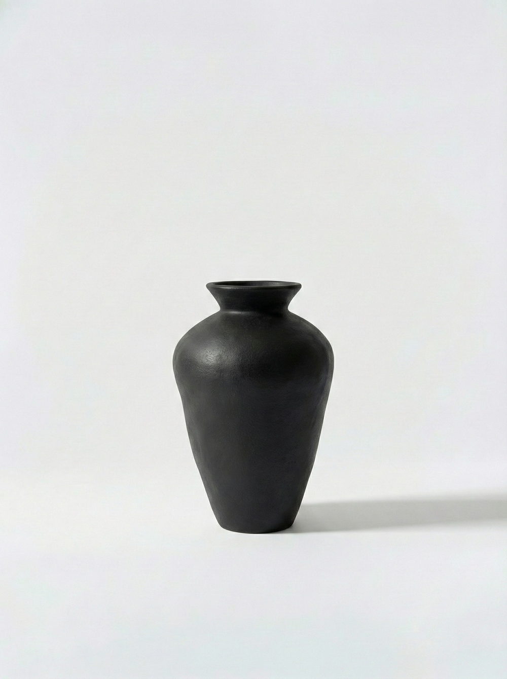 Minimalist black vase on a white background