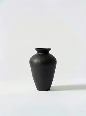 Minimalist black vase on a white background