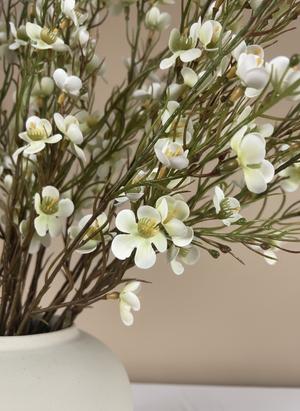 White real touch faux wax flower arrangement with delicate blooms in a matte white ceramic vase for modern home decor #white
