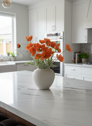 Real touch faux orange poppy arrangement in a white ceramic vase, styled on a marble kitchen island in a modern home #orange 

