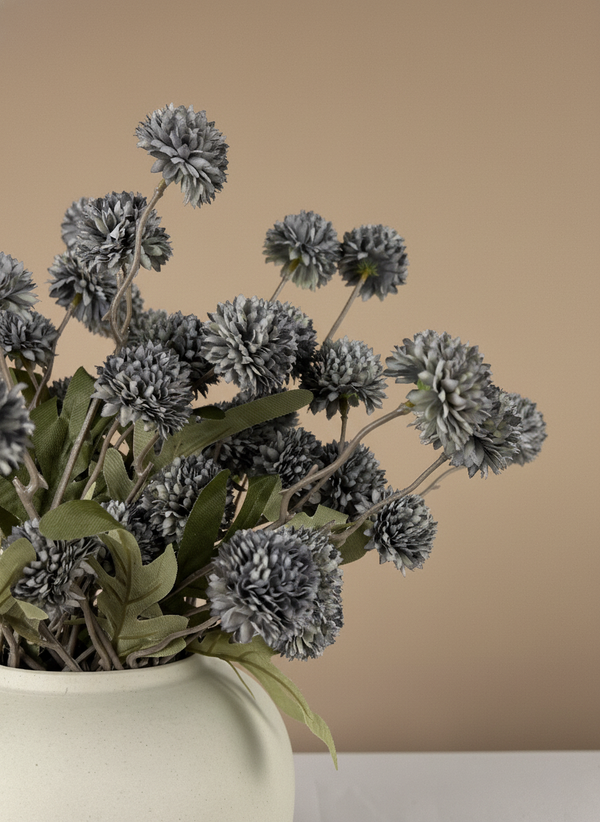 Close up of grey real touch faux pompom flowers with delicate textured blooms arranged in a ceramic vase #grey