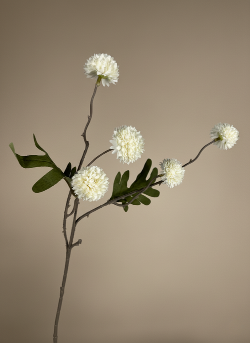 White real touch faux pompom flower stem with delicate textured blooms and natural foliage on a neutral background #white