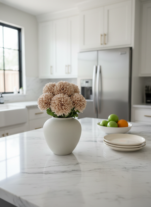 Realistic beige faux pompom flowers in a ceramic vase, styled as modern kitchen island home decor #blush-beige