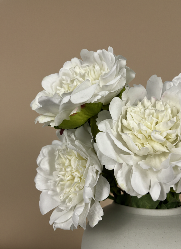 Detailed view of realistic white artificial peonies with soft layered petals #white