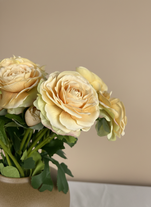 Realistic peach coloured real touch ranunculus artificial flowers arranged in a modern brown ceramic vase #soft-peach