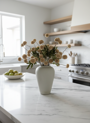 Beige real touch faux pompom flowers styled in a matte ceramic vase on a marble kitchen island #beige