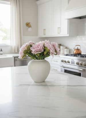 Luxury pink artificial peonies styled in ceramic vase on modern kitchen bench top #baby-pink
