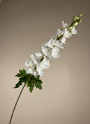 Single faux white delphinium stem with soft blush petals against a neutral background #white