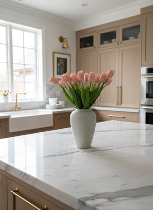 Soft pink faux tulips styled in a ceramic vase as a kitchen island centrepiece in a contemporary home #baby-pink 