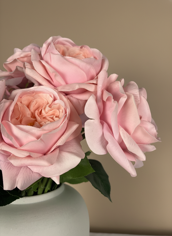 Lifelike faux pink rose blooms with layered petals styled in a minimalist ceramic vase #pink
