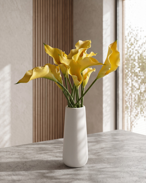 Real touch artificial yellow calla lily arrangement in a white ceramic vase on marble surface #yellow