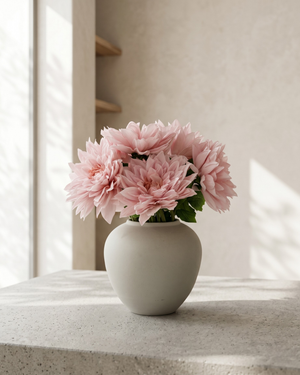 Real touch pink faux dahlia arrangement in a matte ceramic vase on concrete table with neutral background #pink