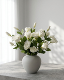 Realistic white faux lisianthus bouquet with buds in minimalist vase on concrete surface #white