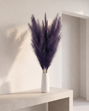 White vase with luxury faux violet pampas grass on a concrete table #deep-violet
