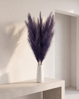 White vase with luxury faux violet pampas grass on a concrete table #deep-violet