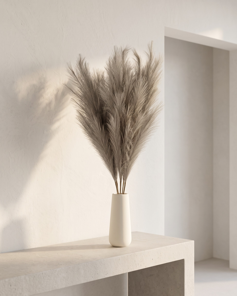Premium brown faux pampas grass bouquet in a minimalist white ceramic vase on a concrete table #light-brown 