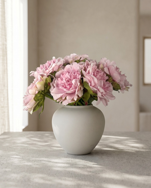 Realistic faux pink peonies in contemporary ceramic vase for home styling #baby-pink