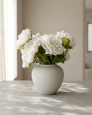 Realistic faux white peonies in contemporary ceramic vase for home styling #white