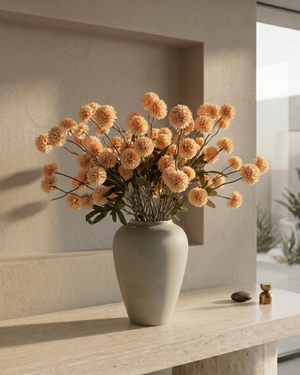 Bouquet of pale-peach coloured  real touch pompon flowers in a grey vase on a light wooden surface with a neutral background #pale-peach