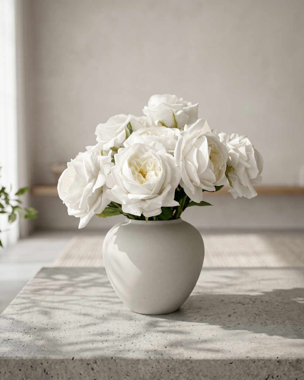 Real touch faux white rose arrangement with soft layered blooms styled in a matte ceramic vase on a concrete surface #white