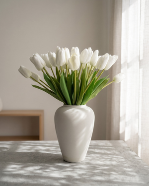 Real touch white faux tulips in a matte off white ceramic vase styled on a marble table for modern home decor #white