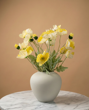 Real touch faux yellow poppy arrangement in a ceramic vase, styled on a marble table for modern home décor #yellow