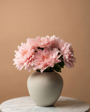 Real touch pink faux dahlia arrangement in a matte ceramic vase on a round marble table #pink
