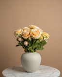 Realistic real touch peach coloured faux ranunculus arrangement in a matte ceramic vase styled on a marble table #soft-peach 