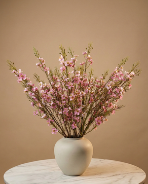 Real touch pink faux wax flower arrangement with delicate blooms in a matte white ceramic vase for modern home decor #pink