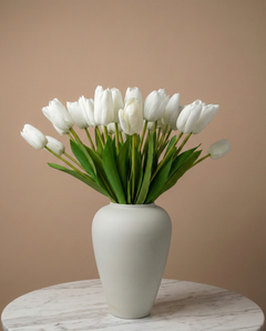 Real touch white faux tulips in a matte off white ceramic vase styled on a marble table for modern home decor #white
