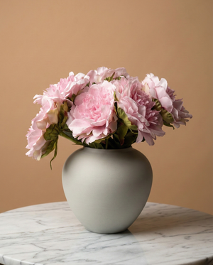 Realistic faux pink peonies in contemporary ceramic vase for home styling #baby-pink