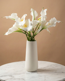 Real touch artificial white calla lily arrangement in a white ceramic vase on marble surface #white