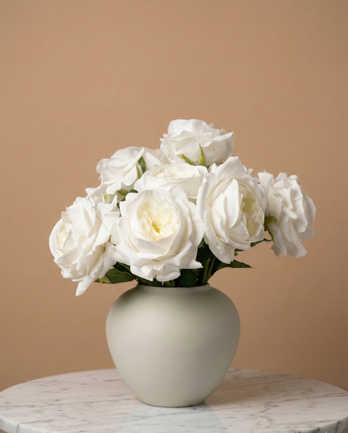 Real touch faux white rose arrangement with soft layered blooms styled in a matte ceramic vase on a marble table #white