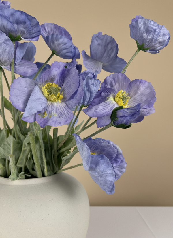 Close-up of vibrant luxury real touch faux blue poppy flowers with realistic centres in a white ceramic vase #lavender-blue