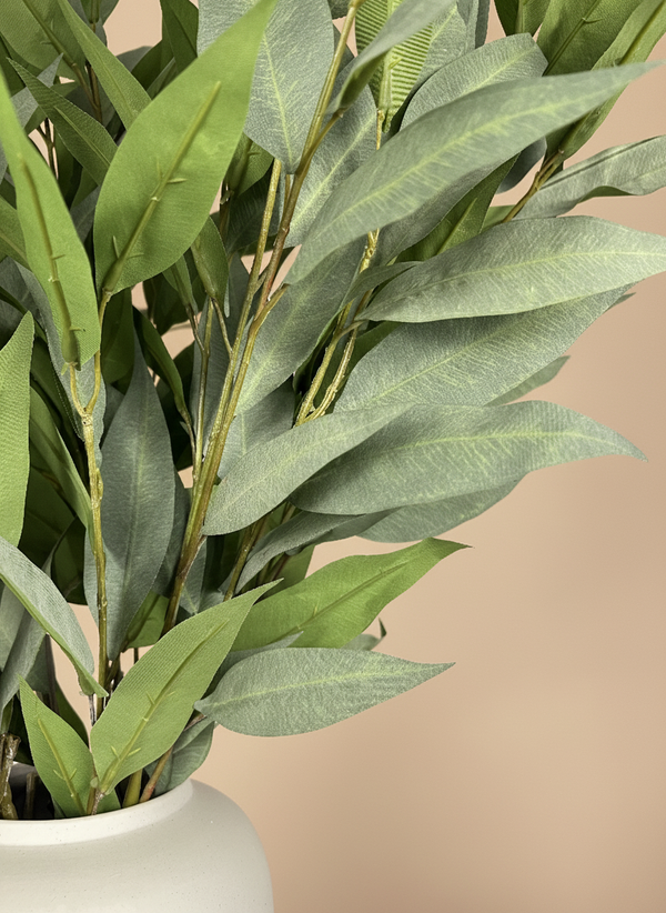 Detailed view of artificial green eucalyptus foliage with lifelike leaf veining
