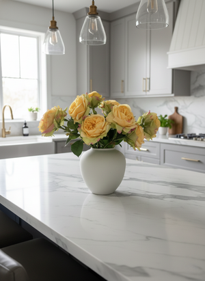 Faux orange rose arrangement in a matte ceramic vase styled on a marble kitchen island in a modern kitchen #apricot-orange 