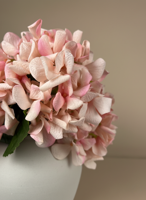 Close-up of real touch peachy pink faux hydrangea blooms with realistic textured petals #peachy-pink