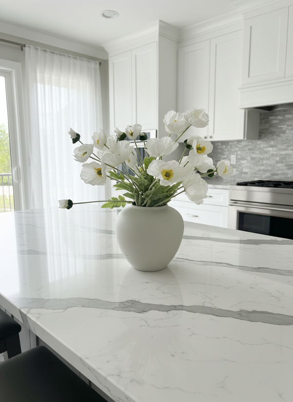 Real touch faux white poppy arrangement in a white ceramic vase, styled on a marble kitchen island in a modern home #white 