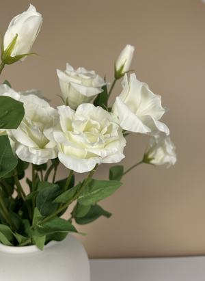 Close-up of white faux lisianthus blooms with lifelike petals and buds #white