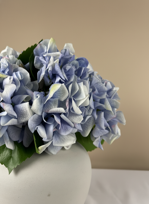 Close-up of real touch blue faux hydrangea blooms with realistic textured petals #periwinkle-blue