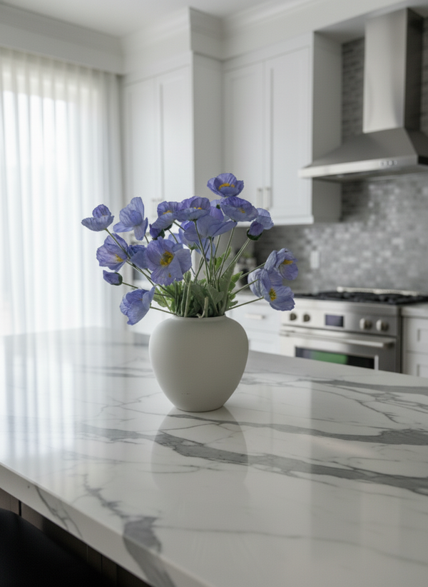 Luxury faux blue poppy arrangement in a white ceramic vase, styled on a marble kitchen island in a modern home #lavender-blue 